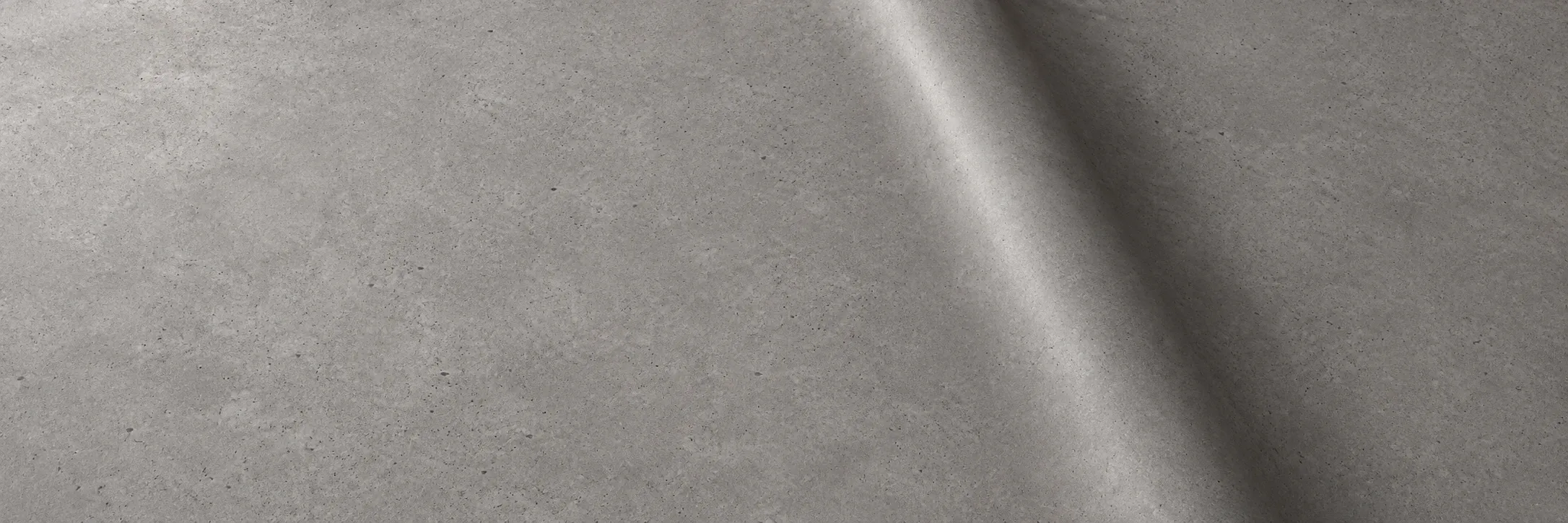 Concrete-effect architectural vinyl with a straight diagonal bend