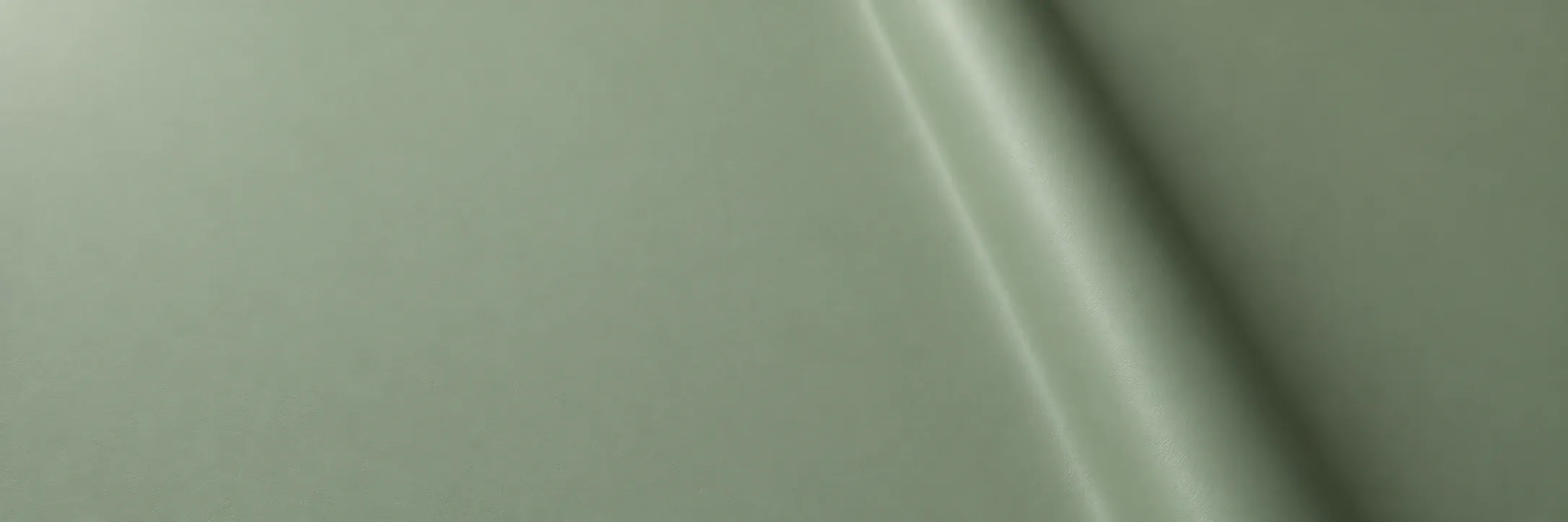 Sage solid colour architectural vinyl with a straight diagonal bend